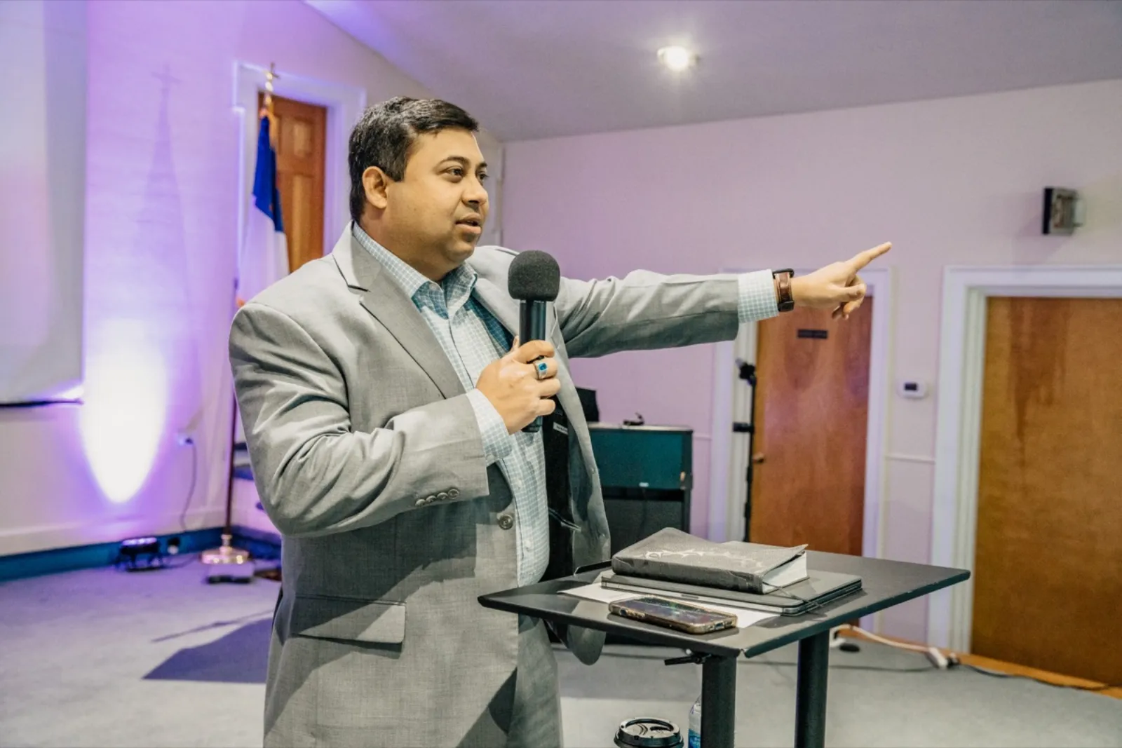 Pastor preaching at New Wine Church Sunday service
