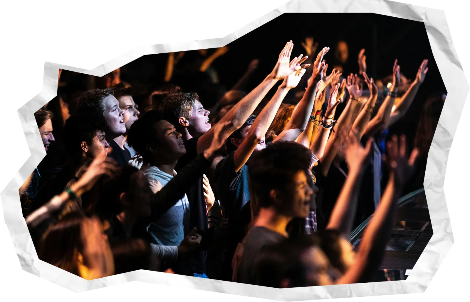 Hands raised in worship — join the community of faith at New Wine Church