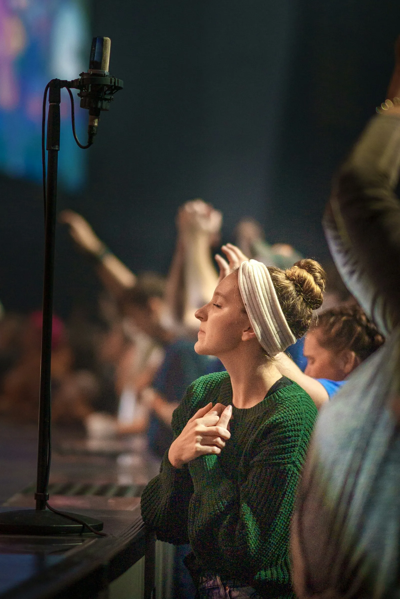 Woman in prayer at New Wine Church Lynchburg VA