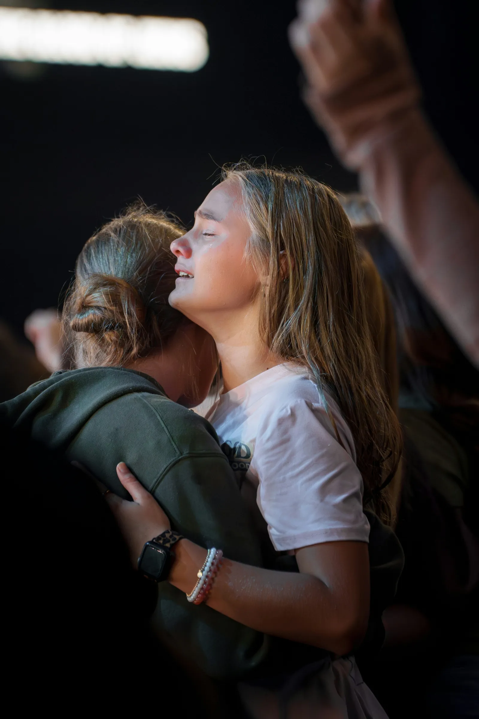 Lifted hands in worship at New Wine Church